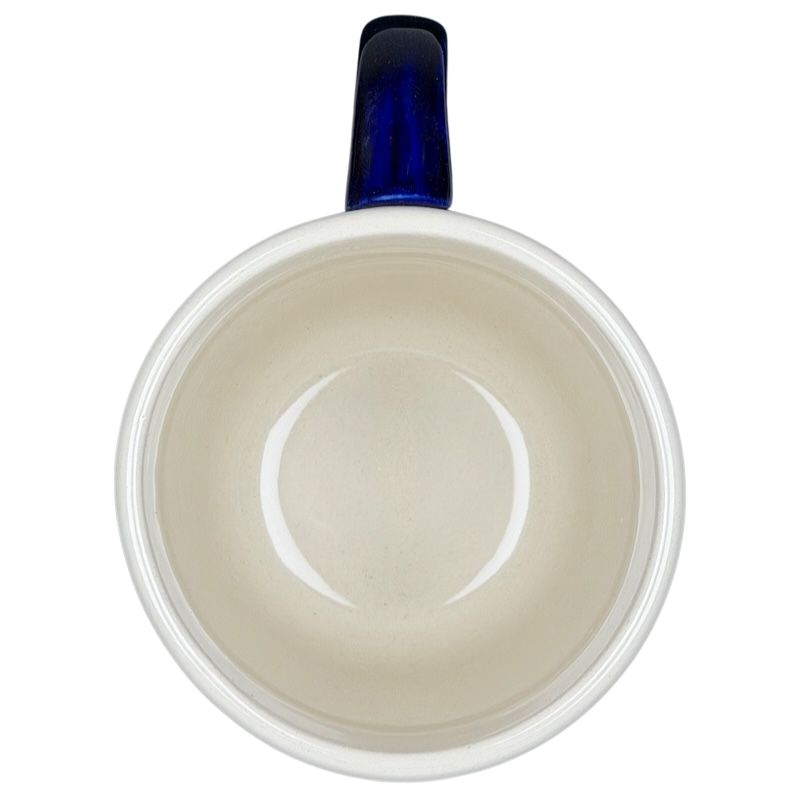 Inside view of Polish Pottery Boleslawiec Blue Polka Dot & Orange Tulip Mug Manufaktura showcasing its smooth ceramic finish