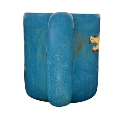 Mara Mexico pottery mug horse featuring a vibrant blue color and unique textured design