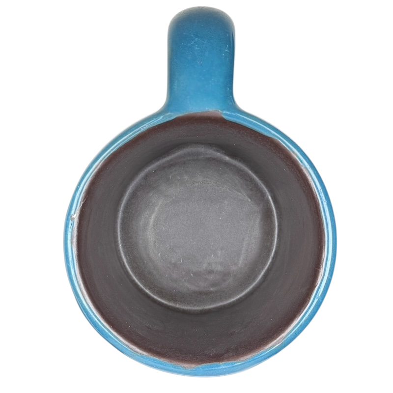 Top view of Mara Mexico pottery mug horse featuring a vibrant blue exterior and dark interior