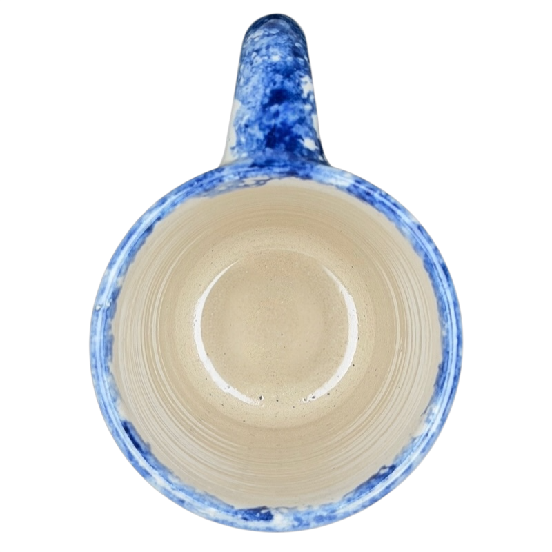 Texas Bluebonnet Pottery Mug Marshall Brand with a blue and beige speckled interior design