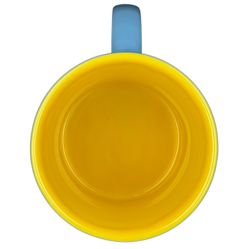 Inside view of a Marvin the Martian 3D mug featuring a bright yellow interior and blue handle