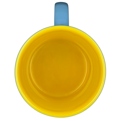 Inside view of a Marvin the Martian 3D mug featuring a bright yellow interior and blue handle