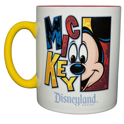 Mickey Mouse Disneyland graphic font mug with colorful design and yellow handle