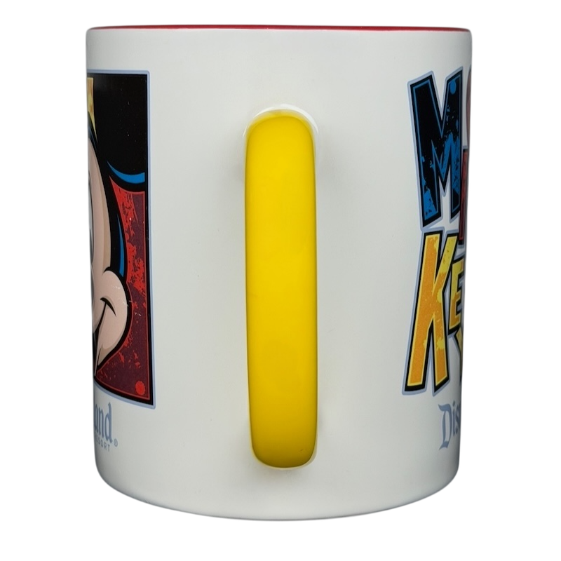 Mickey Mouse Disneyland graphic font mug featuring colorful designs and a yellow handle