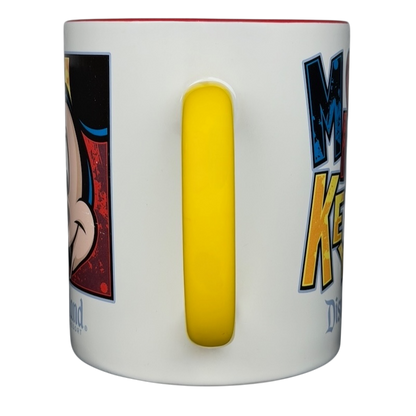 Mickey Mouse Disneyland graphic font mug featuring colorful designs and a yellow handle