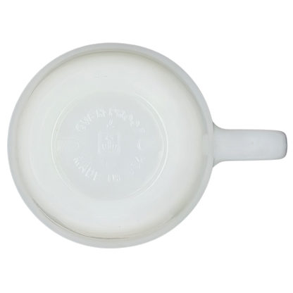 Bottom view of a Disney Mickey Mouse Fantasia Pepsi milk glass mug showcasing its smooth finish