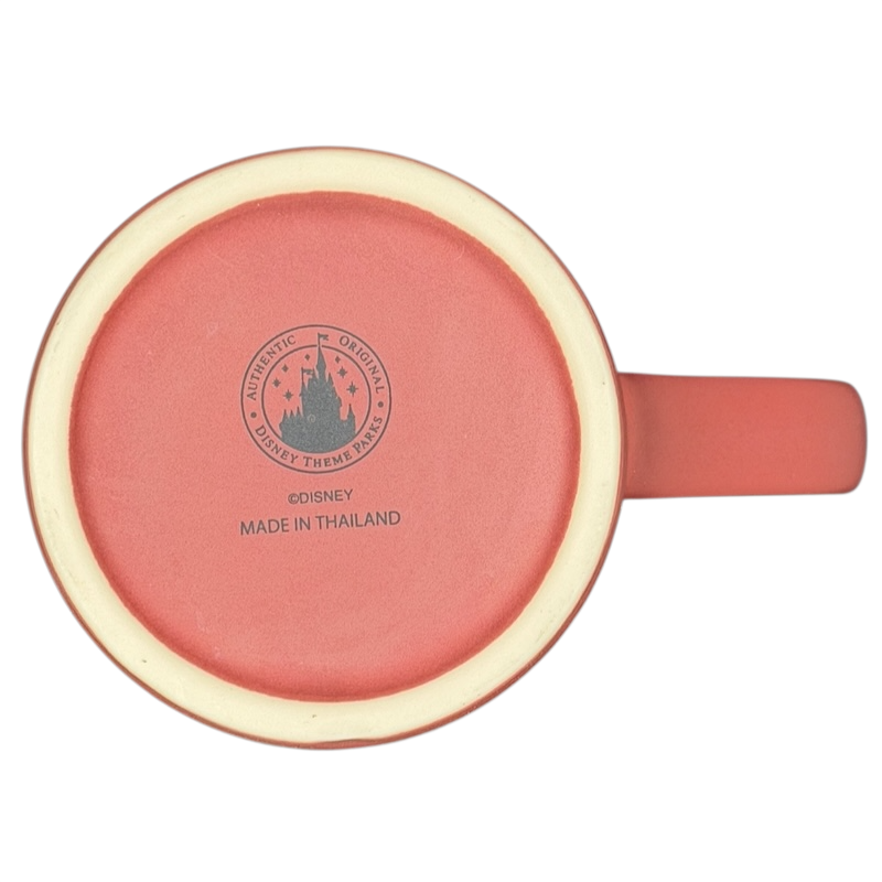Bottom view of a Disney Minnie Mouse 5 Poses Disneyland Mug with a coral color and logo detailing