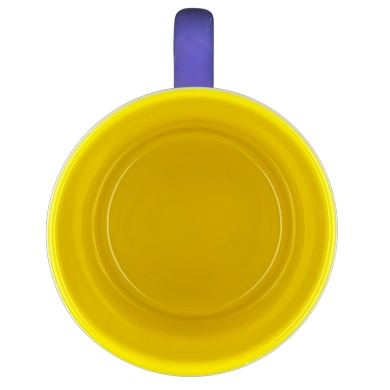 Bright yellow Minnie Mouse Disneyland graphic font mug with a purple handle for Disney fans