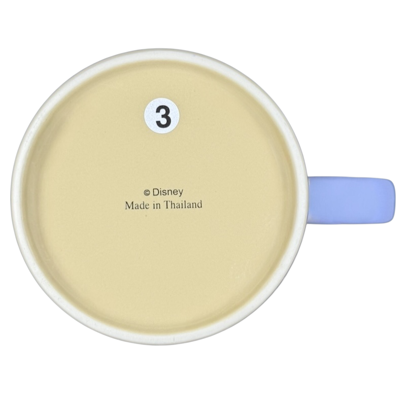 Bottom view of Disney Minnie Mouse mornings aren't pretty jumbo mug with blue handle and yellow interior