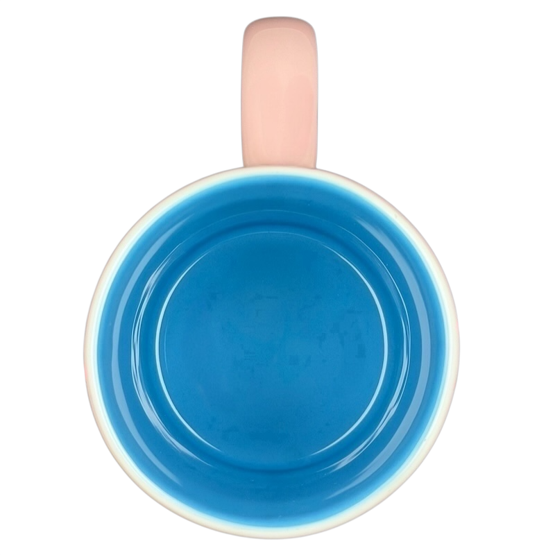 Inside view of Minnie Mouse Waving Disneyland Resort Mug in vibrant blue with a cute pink handle