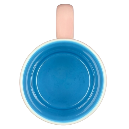 Inside view of Minnie Mouse Waving Disneyland Resort Mug in vibrant blue with a cute pink handle