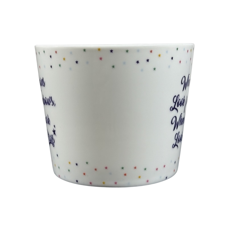 Cooksmart When It Rains Look For Rainbows mug white ceramic with multicolor star border and navy script inspirational quote