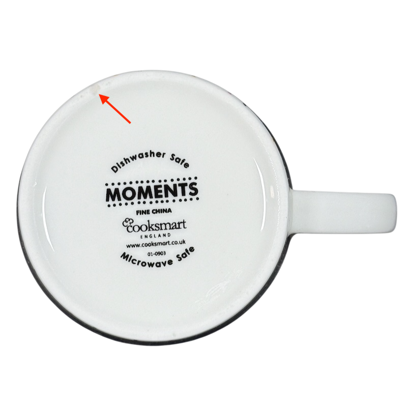 Underside of white ceramic mug showing Cooksmart logo dishwasher microwave safe Cooksmart When It Rains Look For Rainbows mug