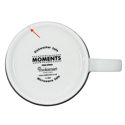 Underside of white ceramic mug showing Cooksmart logo dishwasher microwave safe Cooksmart When It Rains Look For Rainbows mug