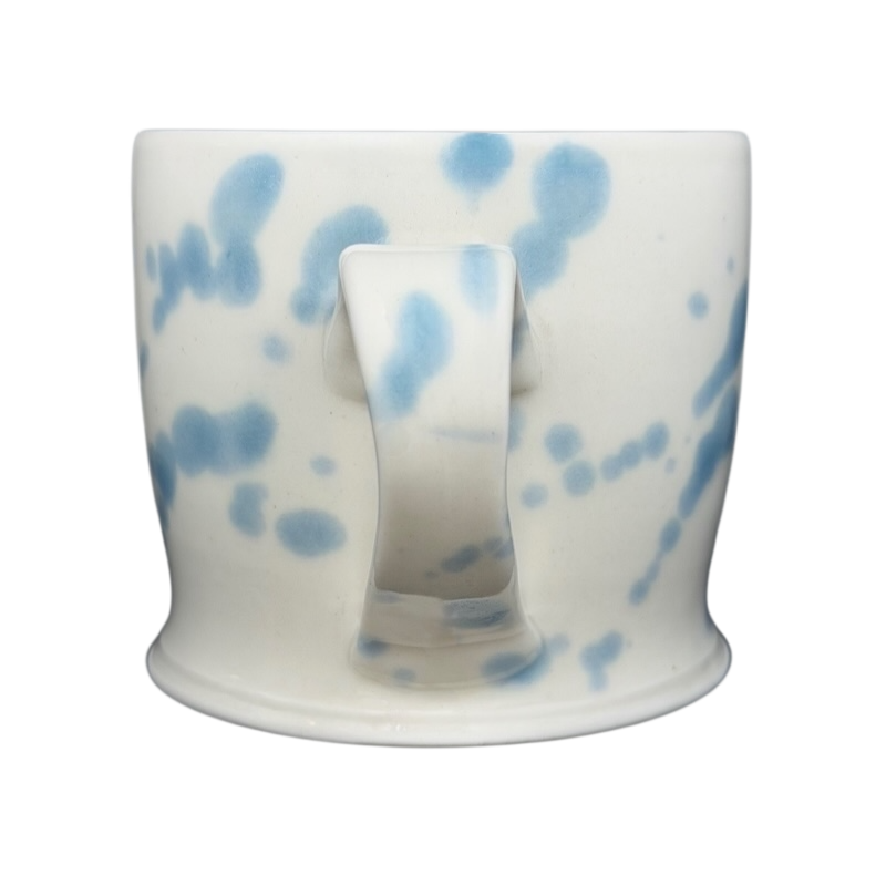 Narwhal signed pottery mug featuring a unique blue and white speckled design