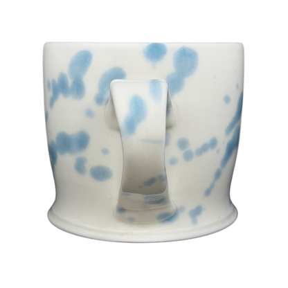 Narwhal signed pottery mug featuring a unique blue and white speckled design