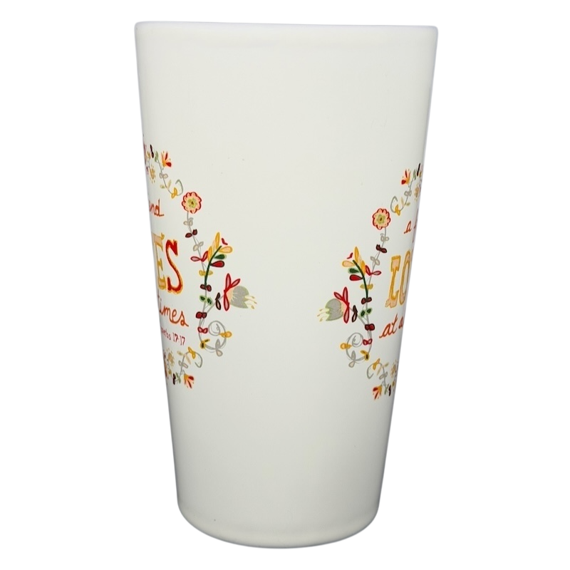 Natural Life A Friend Loves At All Times mug with vibrant floral design and inspirational quote