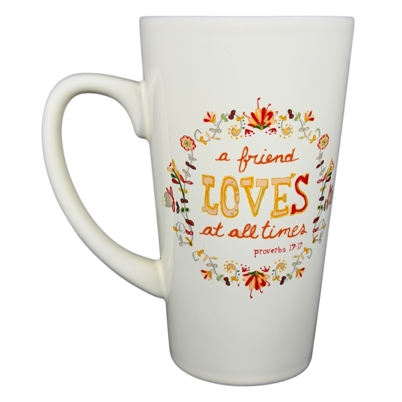 Natural Life A Friend Loves At All Times mug with colorful floral design and inspirational quote