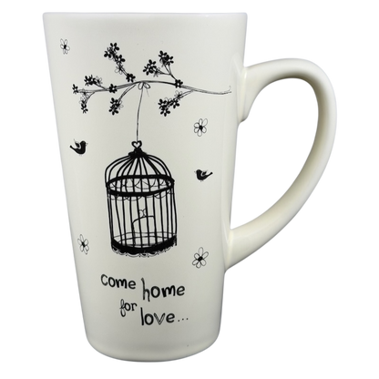 Natural Life Come Home For Love mug featuring a birdcage design and floral accents