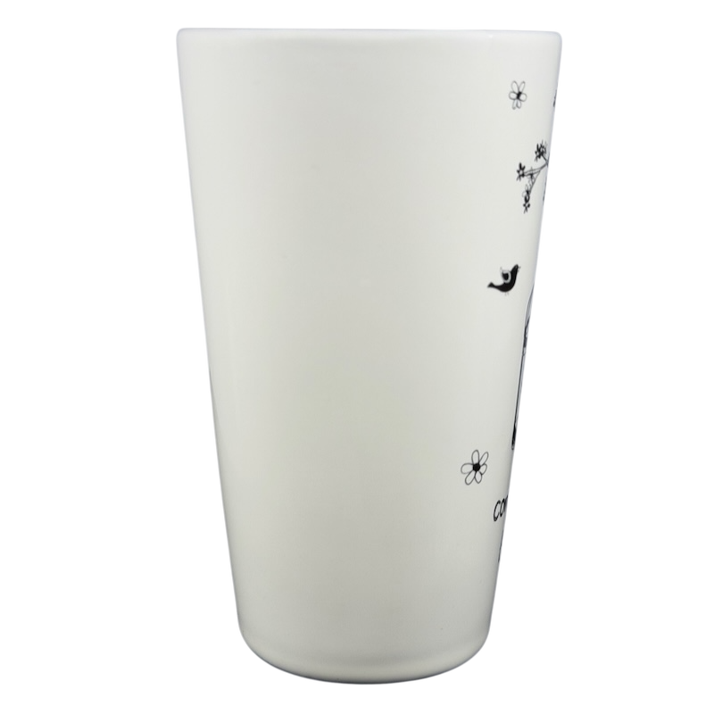 Natural Life Come Home For Love mug with floral and bird designs on a white background