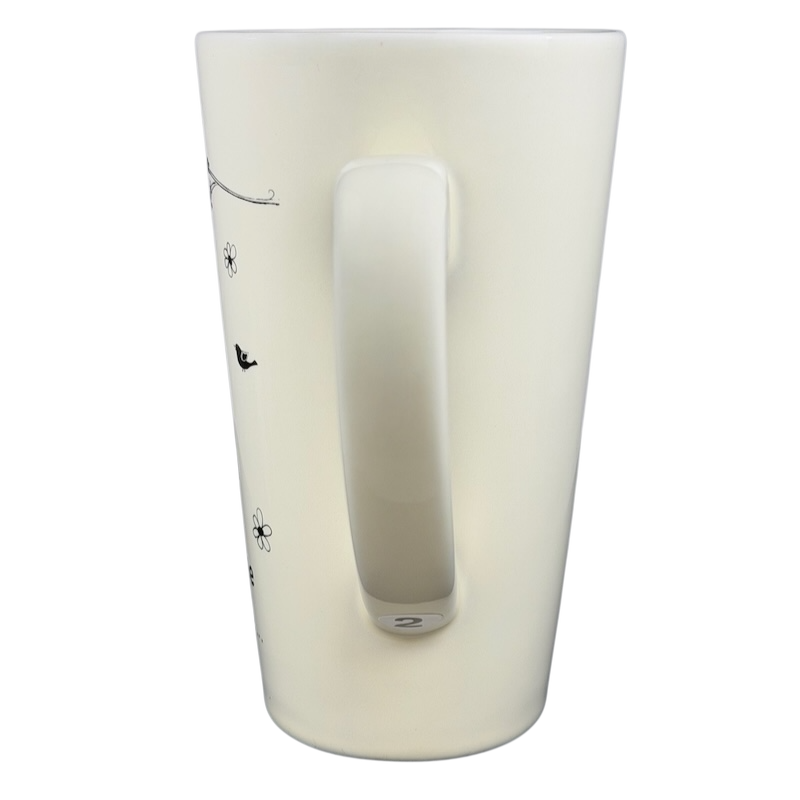 Natural Life Come Home For Love mug in cream color with floral design and a sturdy handle