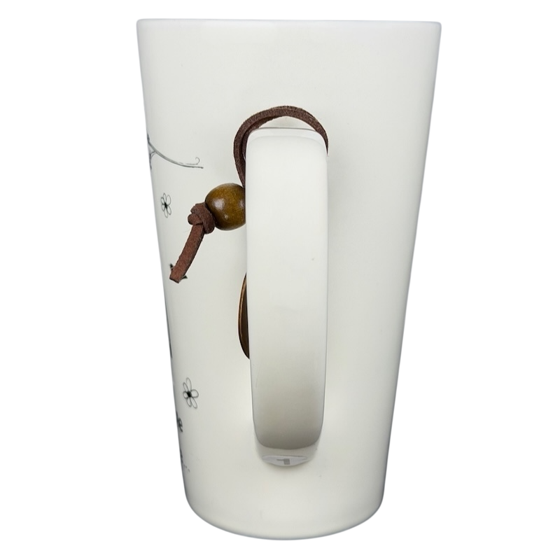 Natural Life Come Home For Love mug with a decorative charm and floral design on white ceramic