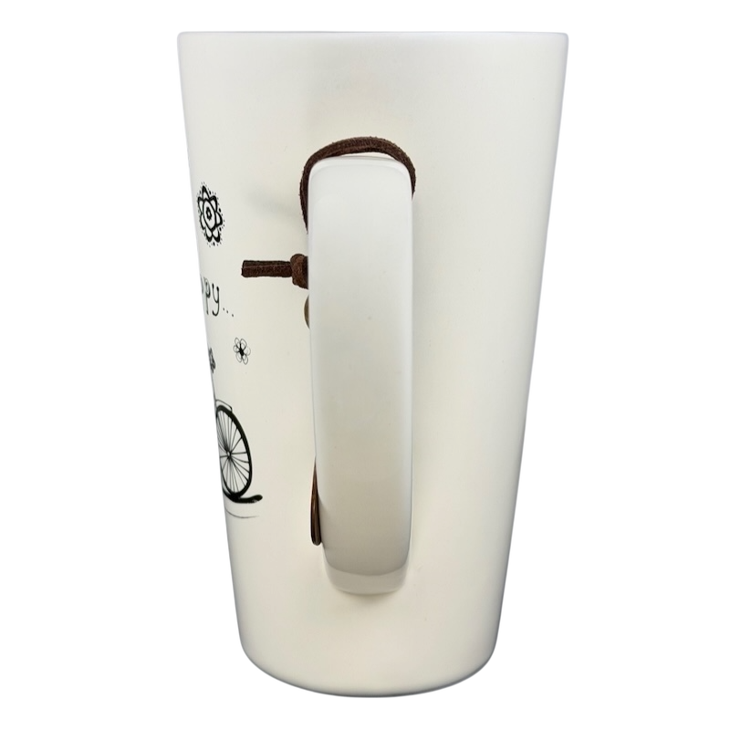 Natural Life Do More Of What Makes You Happy mug featuring a white design and a bicycle illustration