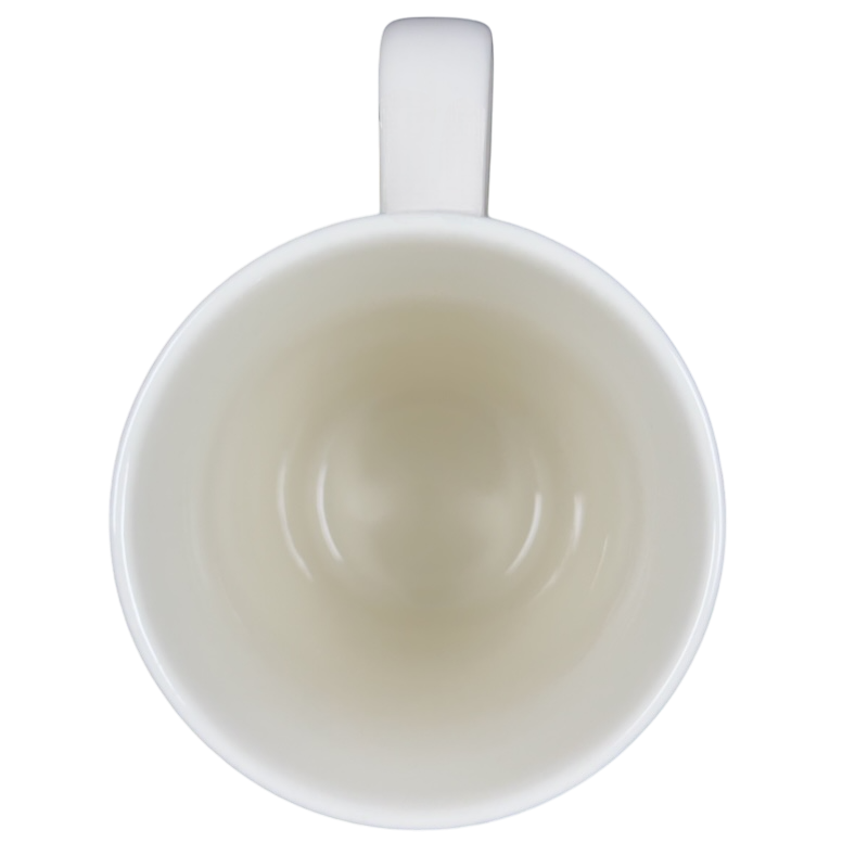 Top view of a white mug that reads Natural Life every home would have a dog mug