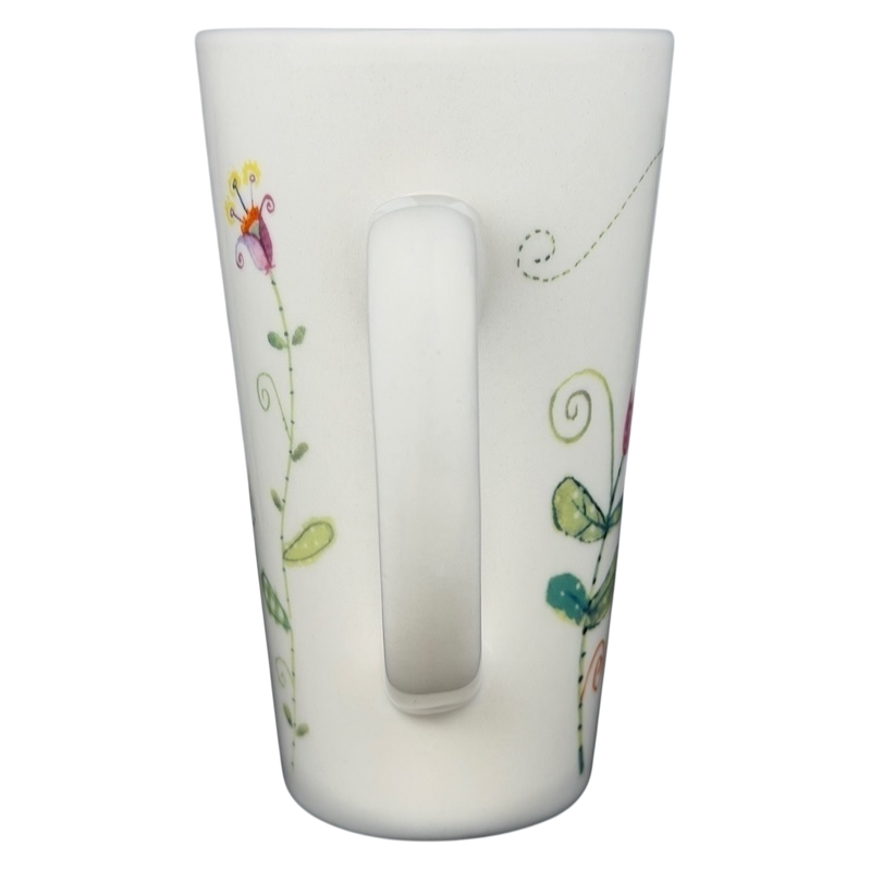 Natural Life Friends Are Like Flowers mug with colorful floral designs and a comfortable handle