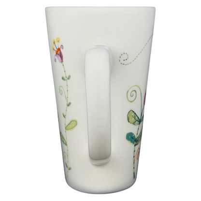 Natural Life Friends Are Like Flowers mug with colorful floral designs and a comfortable handle