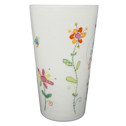 Natural Life Friends Are Like Flowers mug featuring colorful floral designs and whimsical patterns