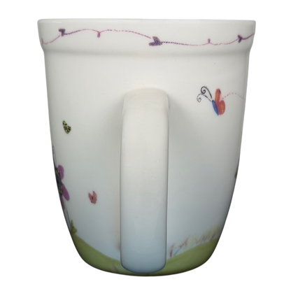 I Can Do All Things Through Christ Natural Life mug with colorful floral design and vibrant butterflies