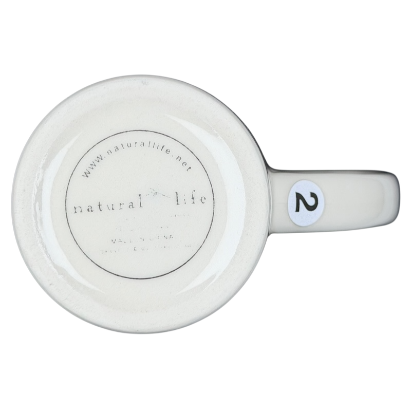 Bottom view of Natural Life mother is a friend mug showcasing the logo and design details
