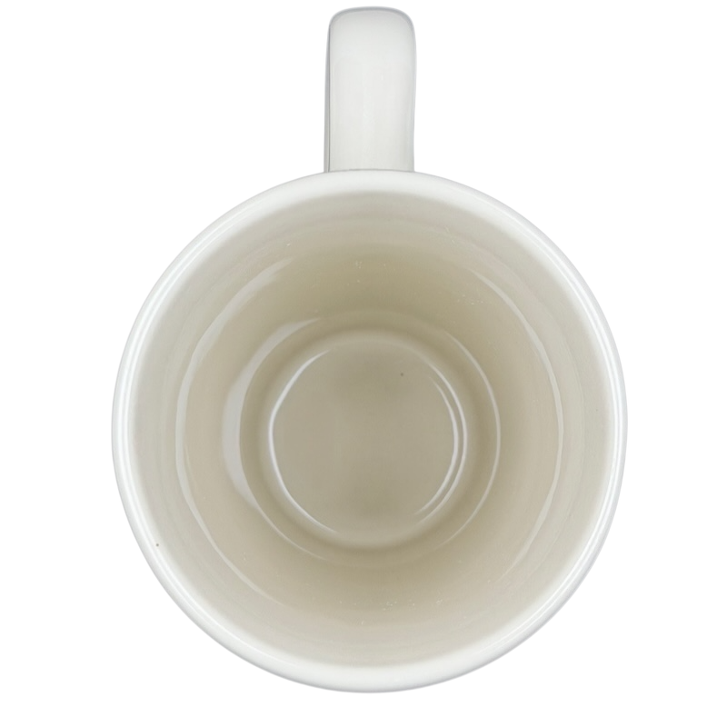 Top view of a Natural Life mother is a friend mug in cream color with a smooth interior finish