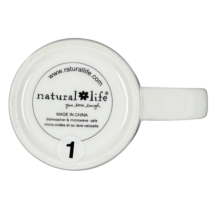 Bottom view of white ceramic mug with Natural Life logo and safety text featuring perfect world Natural Life cat mug