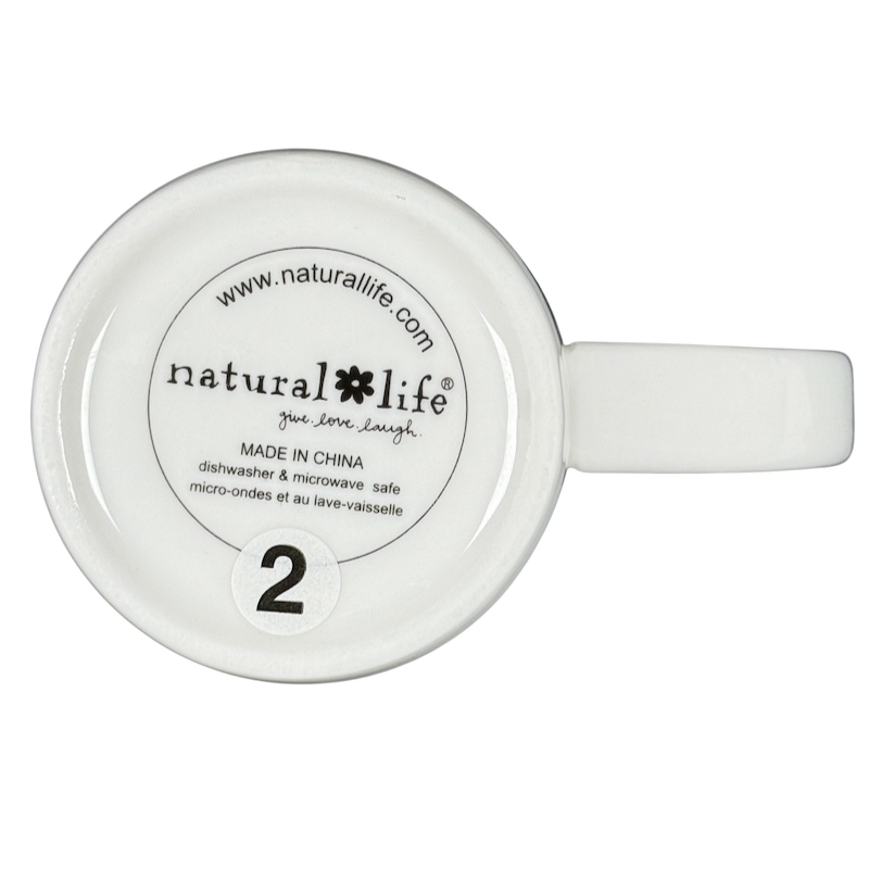 Bottom view of white mug with Natural Life logo and markings handle visible perfect world Natural Life cat mug
