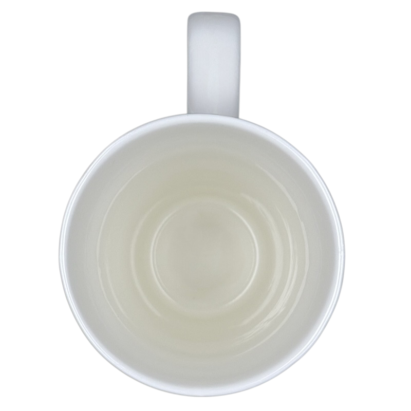 Top view of empty white perfect world Natural Life cat mug with handle at top on black background