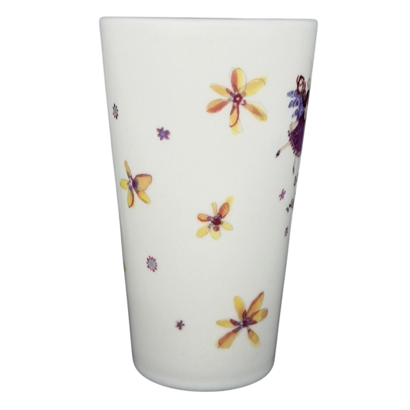 Natural Life There's an Angel Watching Over You mug with colorful flower designs and whimsical graphics