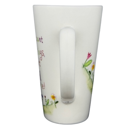 Natural Life When I Count My Blessings mug with colorful floral designs and inspirational text