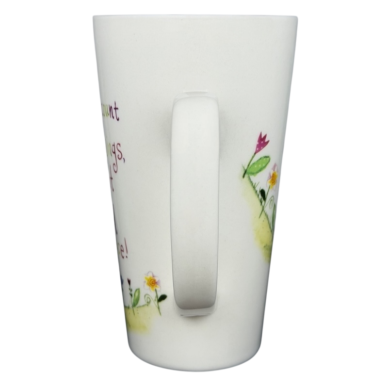 Natural Life When I Count My Blessings mug featuring floral designs and inspirational text