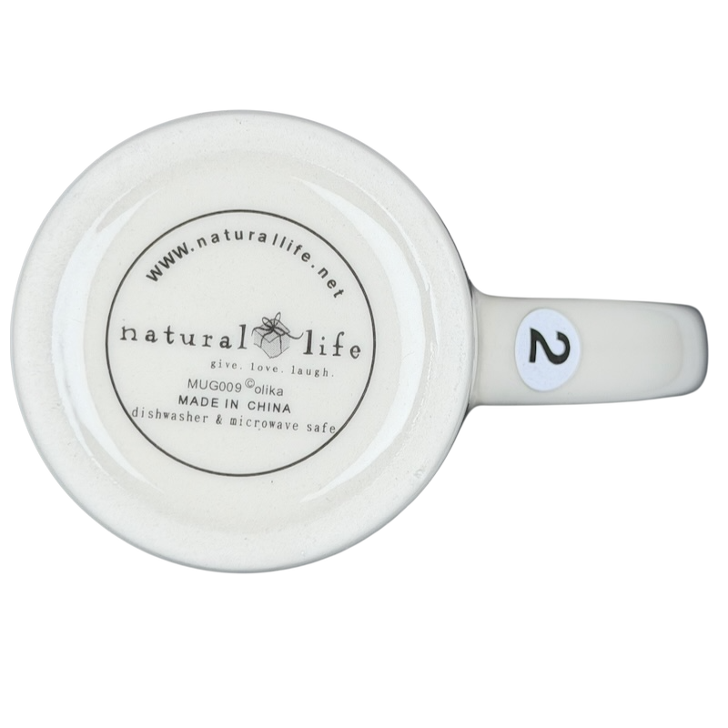 Bottom view of the Natural Life When I Count My Blessings mug showing branding and care instructions