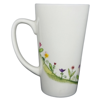 Natural Life When I Count My Blessings mug featuring a colorful floral design on a white background