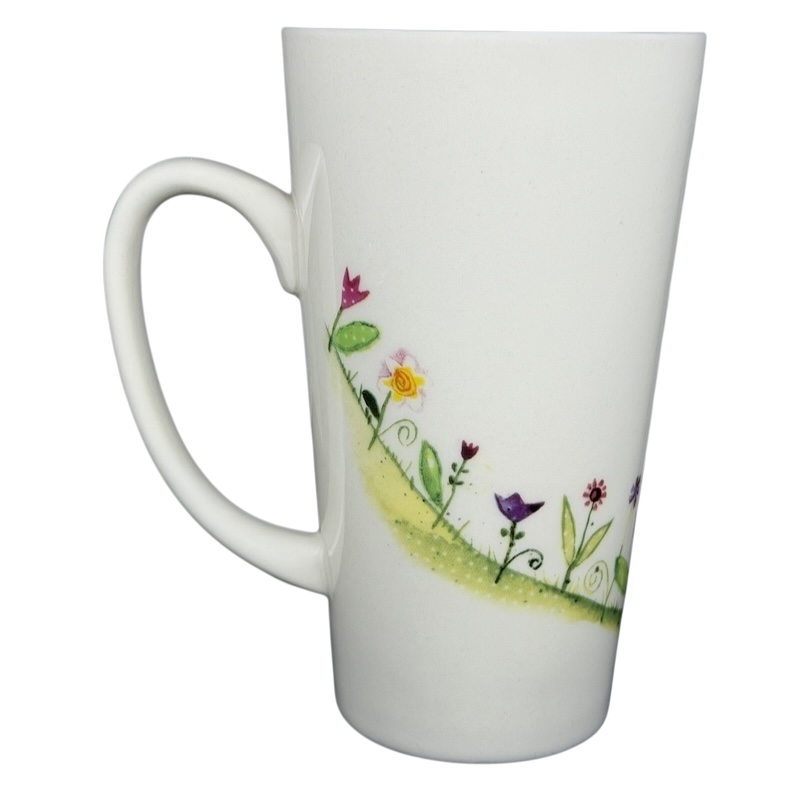 Natural Life When I Count My Blessings mug with colorful flower designs on a white background