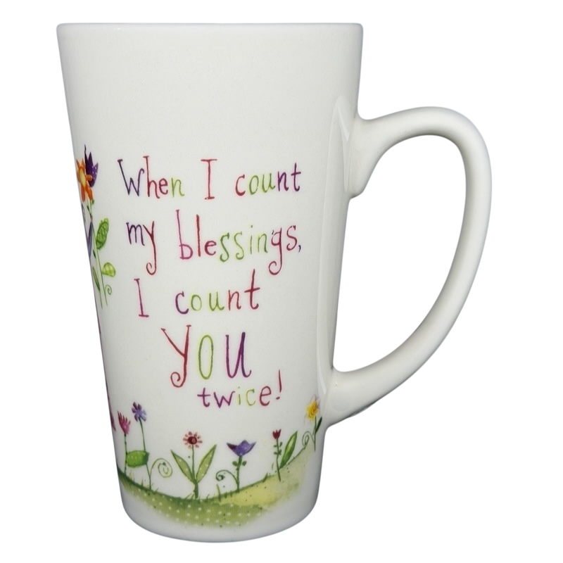 Natural Life When I Count My Blessings mug with colorful floral design and uplifting quote
