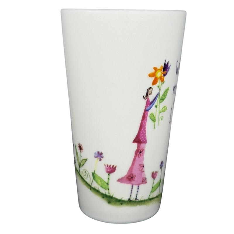 Natural Life When I Count My Blessings mug featuring a girl holding a vibrant flower design