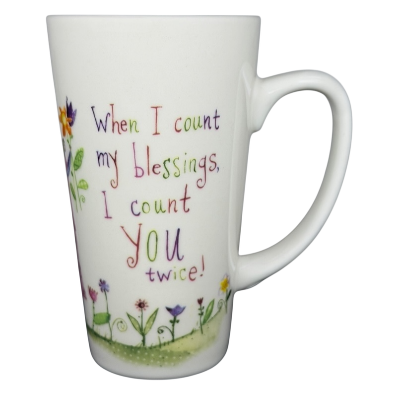 Natural Life When I Count My Blessings mug with colorful floral design and inspirational text