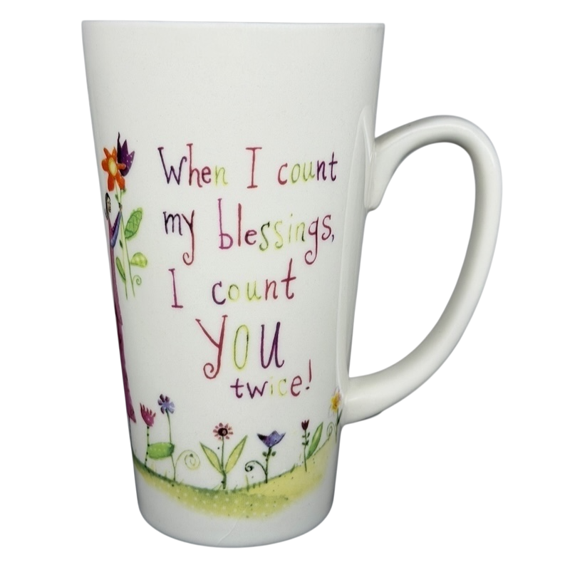 Natural Life When I Count My Blessings mug featuring colorful floral design and inspiring quote