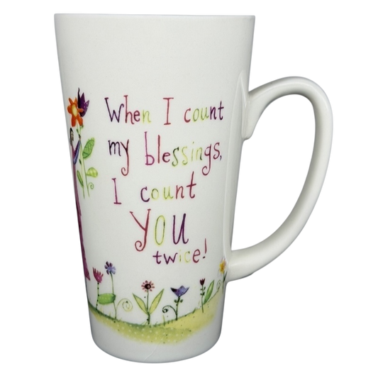 Natural Life When I Count My Blessings mug featuring colorful floral design and inspiring quote