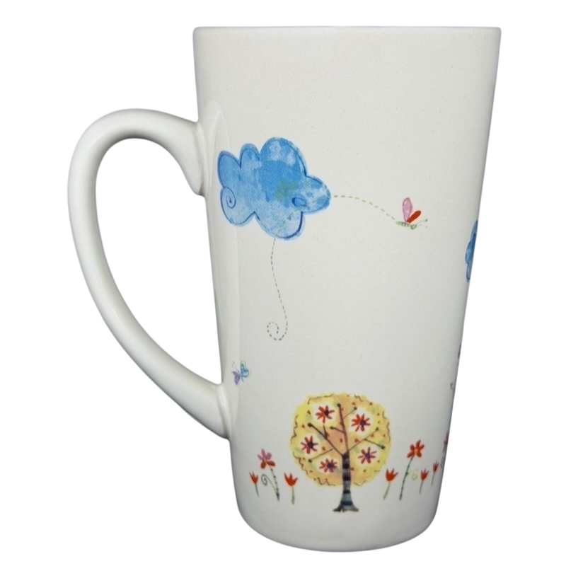 Natural Life You Mean The World To Me mug with colorful floral and cloud designs