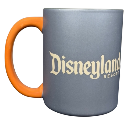 Oswald The Lucky Rabbit Disneyland Resort Mug with a vibrant orange handle and a smooth gray finish